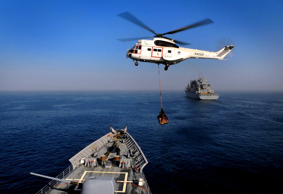 US Navy 090324-N-4774B-015 An SA-330 Puma helicopter flies from the Military Sealift Command dry cargo-ammunition ship USNS Lewis and Clark (T-AKE 1) to deliver mail to the guided-missile cruiser USS Lake Champlain (CG 57)