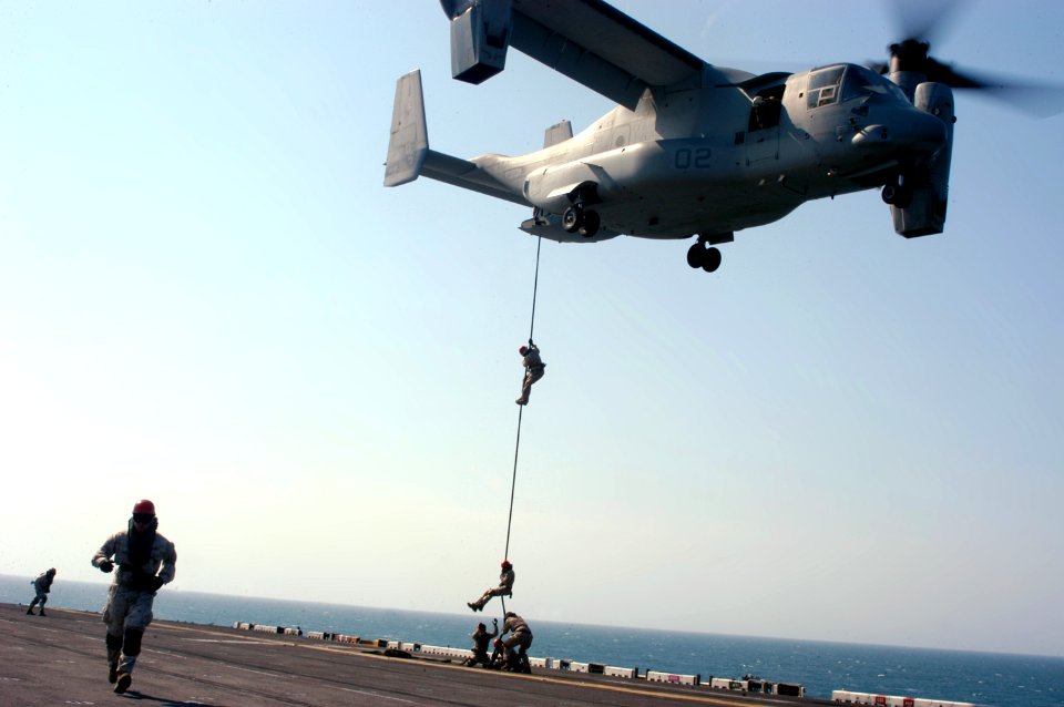 US Navy 090323-N-8154G-344 Marines assigned to the 22nd Marine Expeditionary Unit (MEU) conduct a fast-rope exercise from an MV-22B Osprey onto the flight deck of the amphibious assault ship USS Bataan (LHD 5)