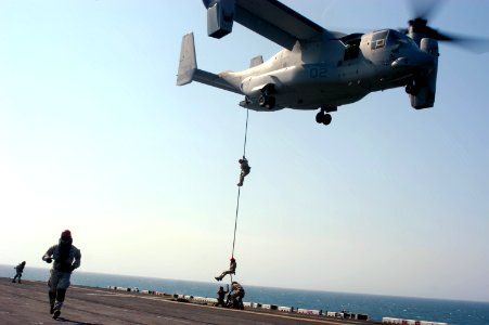 US Navy 090323-N-8154G-344 Marines assigned to the 22nd Marine Expeditionary Unit (MEU) conduct a fast-rope exercise from an MV-22B Osprey onto the flight deck of the amphibious assault ship USS Bataan (LHD 5)