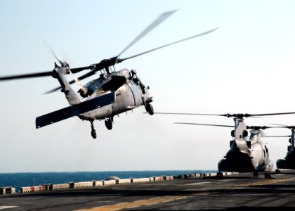 US Navy 090324-N-4236E-148 An MH-60S Sea hawk helicopter assigned to Helicopter Sea Combat Squadron (HSC) 26 lifts off from the multi-purpose amphibious assault ship USS Iwo Jima (LHD 7) photo