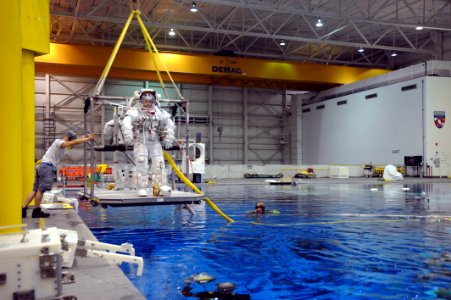 US Navy 090324-N-2959L-313 Lt. Cmdr. Chris Cassidy is lowered into the Neutral Buoyancy Lab (NBL) for a mission training session in Houston