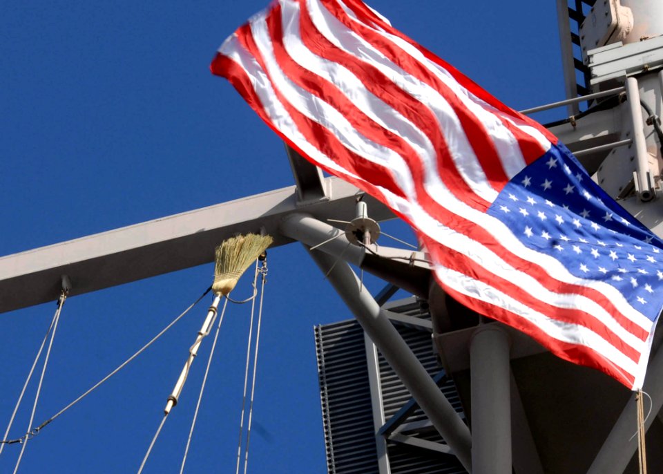 US Navy 090326-N-0515W-059 A broom is hoisted to the mast of the amphibious assault ship USS Bonhomme Richard (LHD 6)