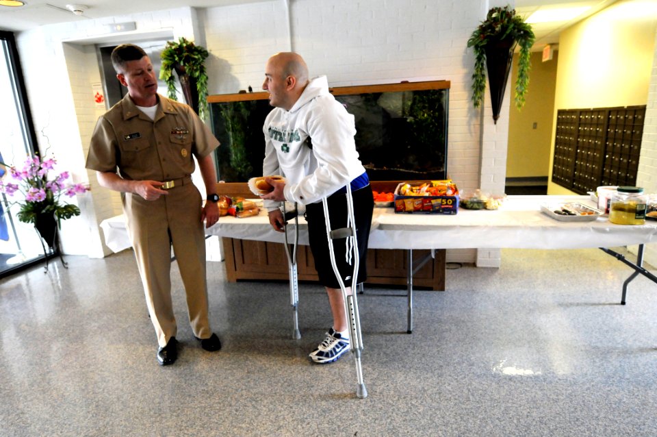 US Navy 090325-N-9818V-088 Master Chief Petty Officer of the Navy (MCPON) Rick West visits with Fire Control Technician James Hollkamp at Mercy Hall during his visit to National Naval Medical Center Bethesda
