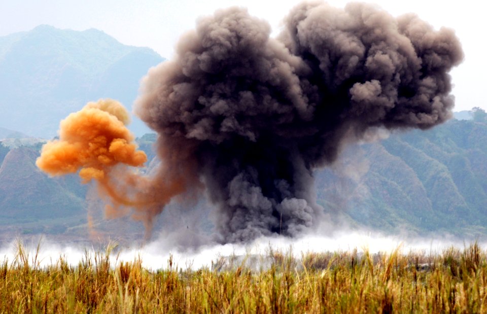 US Navy 090325-N-7130B-342 Smoke billows into the sky above Crow Valley, Philippines after a scheduled ordnance disposal photo