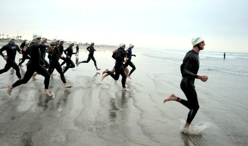 US Navy 090329-N-2959L-169 Athletes race to the water to begin the swim portion of the 31st annual Superfrog Triathlon at Silver Strand State Beach