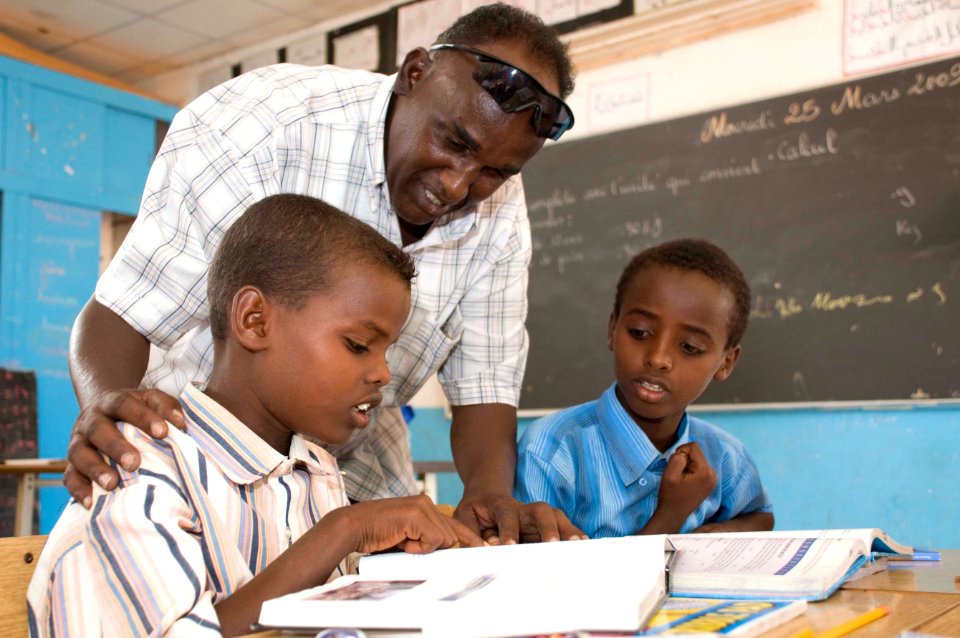 US Navy 090326-N-9552I-052 Djiboutian students read newly delivered educational books delivered by the Marine 9th Provisional Security Force (9th PSF), stationed in St. Paul, Minn., in Nagad, Djibouti