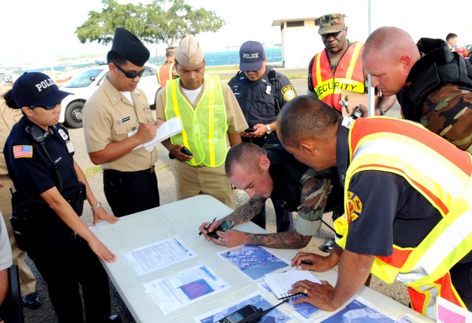 US Navy 090325-N-3666S-107 Personnel assigned to Naval Station Pearl Harbor review a map of the affected area during a chemical, biological, radiological, nuclear and explosive exercise on historic Ford Island