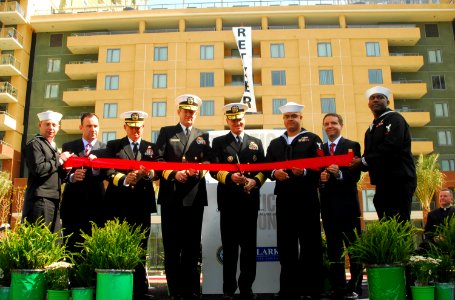 US Navy 090326-N-5617R-169 Vice Chief of Naval Operations Adm. Patrick Walsh, center right, and distinguished guests cut a ribbon during the grand opening of the Pacific Beacon military housing facility at Naval Base San Diego photo