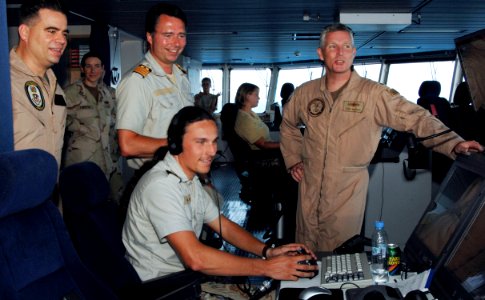 US Navy 090327-N-6639M-056 Rear Adm. Terence McKnight and Capt. Mark Cedrun visit the Royal Danish Navy command and support ship HDMS Absalon (L16) during counter-piracy operations photo
