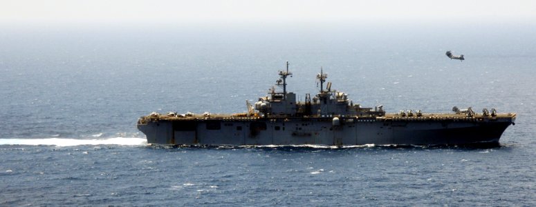 US Navy 090327-N-6639M-030 A CH-46 helicopter flies near the amphibious assault ship USS Boxer (LHD 4)