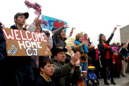 US Navy 090327-N-3595W-072 Family members welcome home Sailors assigned to the guided-missile cruiser USS Vella Gulf (CG 72) during their return from a seven-month deployment
