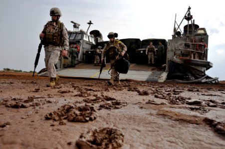 US Navy 090401-N-0506A-222 Marines from the 13th Marine Expeditionary Unit (13th MEU) disembark a landing craft air cushion after landing on the beach during an exercise near Camp Lemonier, Djibouti photo