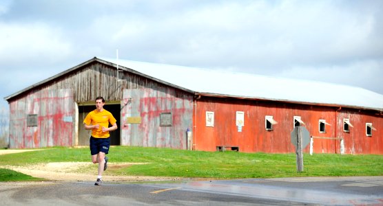 US Navy 090326-N-7948R-004 Personnel Specialist 2nd Class Joshua Sickles, assigned to Navy Recruiting Command, participates in the Navy Marine Corps Relief Society 5K Race at Navy Lake