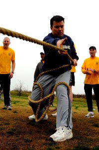 US Navy 090327-N-8907D-470 Chief Cryptologic Technician (Technical) Alex Brown, assigned to the guided-missile destroyer USS Barry (DDG 52), competes in the Goat Locker Challenge during the 116th chief petty officer birthday ce
