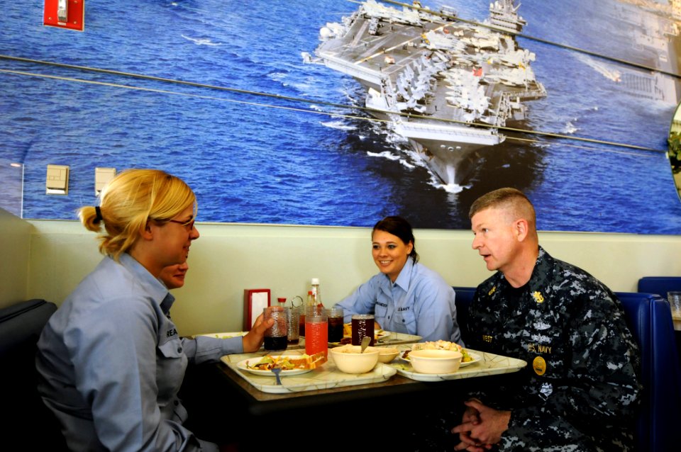 US Navy 090330-N-9818V-343 Master Chief Petty Officer of the Navy (MCPON) Rick West sits with Airman Recruit Kelli Neuenswander, Airman Recruit Ashley Hoover and Airman Recruit Rachel Reasey