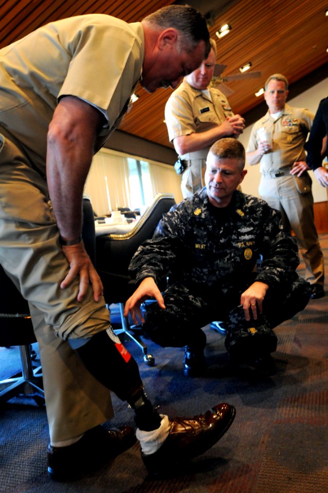 US Navy 090330-N-9818V-037 Master Chief Petty Officer of the Navy (MCPON) Rick West speaks with Aviation Ordnanceman Master Chief Wil Wilson after having breakfast with local command master chiefs and senior enlisted leaders