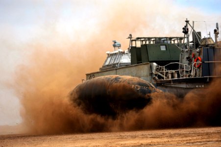US Navy 090401-N-0506A-513 A Landing Craft Air Cushion (LCAC) from Assault Craft Unit (ACU) 5 comes ashore on a beach during an exercise near Camp Lemonier, Djibouti