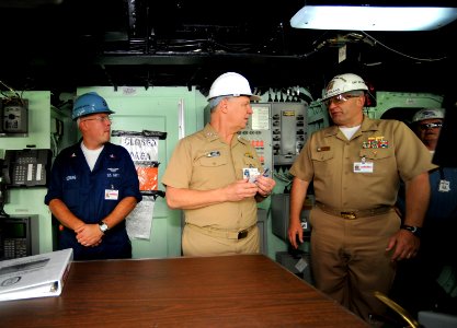 US Navy 090331-N-8273J-272 Chief of Naval Operations (CNO) Adm. Gary Roughead, center, speaks with Quartermaster 2nd Class Jonathan Voldberg, left, and Commanding Officer Capt. Robert George Kopas during a visit to the amphibio