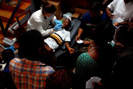 US Navy 090403-N-1688B-102 Lt. Cmdr. Shay Razmi and Hospital Corpsman 2nd Class Hector Centeno examine a young patient during a medical civic action program at Regional Hospital Limbe, Cameroon, as part of Africa Partnership St photo