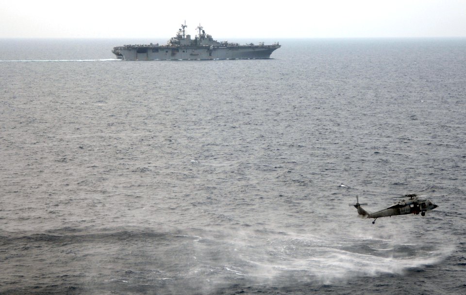 US Navy 090401-N-6639M-414 Members of Helicopter Sea Combat Squadron (HSC) 21, Detachment 3, conduct search and rescue training near the amphibious assault ship USS Boxer (LHD 4)