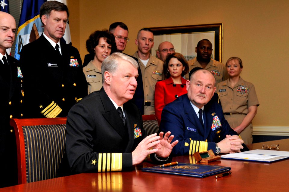 US Navy 090401-N-8273J-023 Chief of Naval Operations (CNO) Adm. Gary Roughead, left, delivers remarks as Commandant of the Coast Guard Adm. Thad W. Allen looks on after the signing of a memorandum of agreement for the Safe Harb