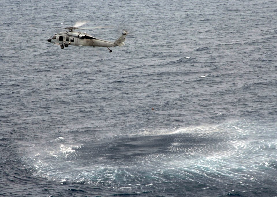 US Navy 090401-N-6639M-363 Members of Helicopter Sea Combat Squadron (HSC) 21, Detachment 3, conduct search and rescue training near the amphibious assault ship USS Boxer (LHD 4)
