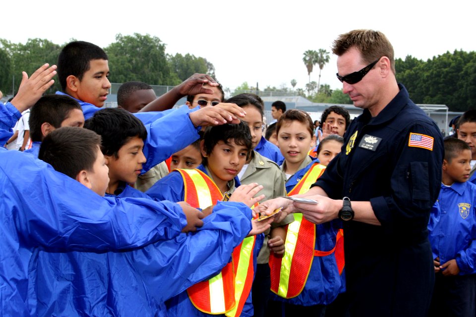 US Navy 090402-N-5366K-051 Chief Special Warfare Boat Operator J.C. Ledbetter, assigned to the U.S. Navy Parachute Team, hands out stickers and answers questions