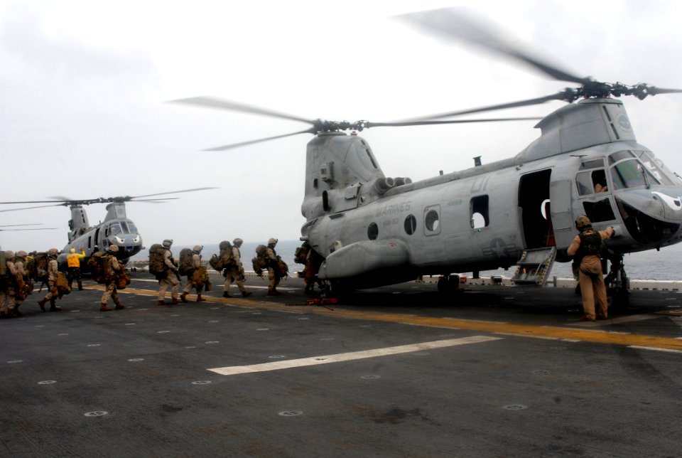 US Navy 090401-N-6552M-070 Marines from the 13th Marine Expeditionary Unit (13th MEU) embarked aboard the amphibious assault ship USS Boxer (LHD 4) board a CH-46 Sea Knight helicopter