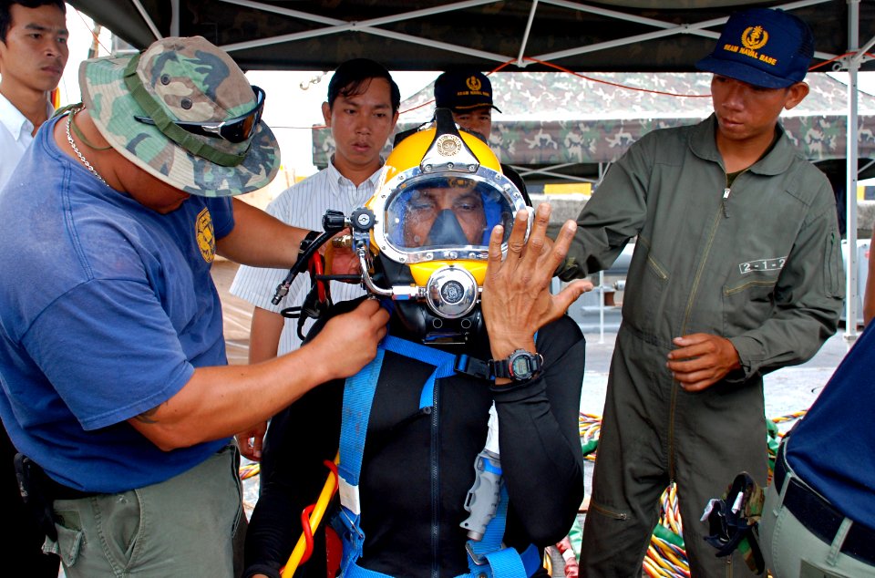 US Navy 090402-N-7095C-001 Senior Chief Navy Diver Cesar J. Torres, assigned to Mobile Diving and Salvage Unit (MDSU) 1, conducts pre-dive equipment checks before a joint U.S. and Cambodian dive