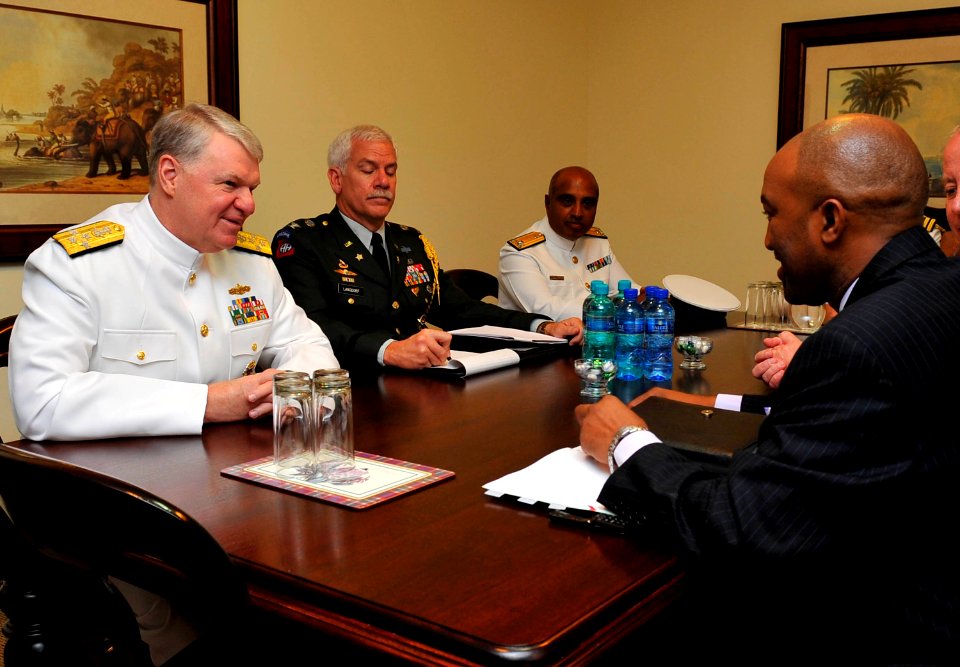 US Navy 090406-N-8273J-064 Chief of Naval Operations (CNO) Adm. Gary Roughead, left, meets with acting Secretary for Defense Mr. Tsepe Motuni, right and other senior leadership during a conference call at the Defense Headquarte