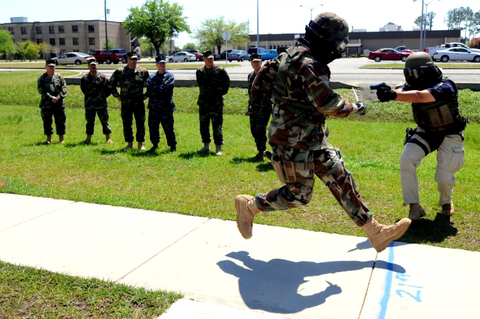 US Navy 090403-N-9818V-296 Master Chief Petty Officer of the Navy (MCPON) Rick West watches drills from the Expeditionary Combat Skills course taught on Naval Construction Battalion Center, Gulfport