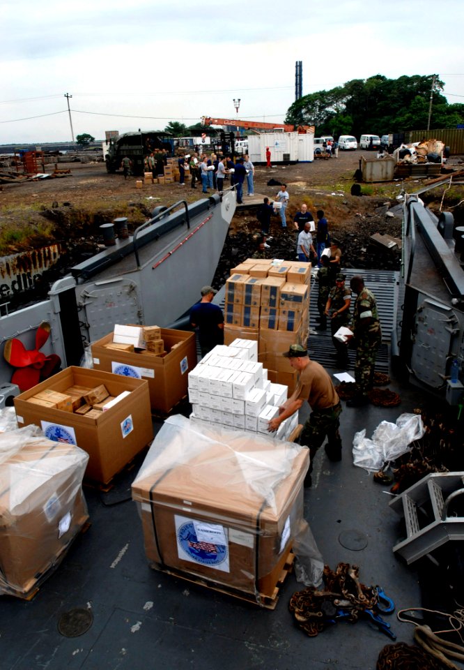 US Navy 090403-N-7948C-080 Sailors assigned to Africa Partnership Station Nashville unload donated Project Handclasp supplies and toys for distribution to several donation spots in Limbe, Cameroon