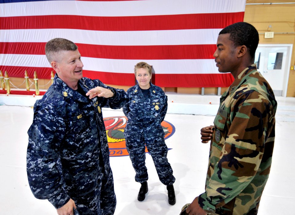 US Navy 090401-N-9712C-003 Master Chief Petty Officer of the Navy Rick West, left, speaks with Master-at-Arms 1st Class Carlos Jones at Naval Air Station Joint Reserve Base (NAS JRB) New Orleans
