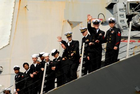 US Navy 090409-N-8907D-118 Sailors assigned to the guided-missile destroyer USS Mahan (DDG 72) wave to family members during homecoming celebrations at Naval Station Norfolk photo