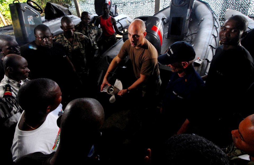 US Navy 090406-N-1688B-423 Chief Machinist's Mate Brian Wallace, embarked aboard the amphibious transport dock ship USS Nashville (LPD 13), conducts an Africa Partnership Station small boat engine repair and maintenance trainin