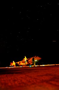 US Navy 090411-N-4010S-017 An AV-8B Harrier assigned to Marine Attack Squadron (VMA) 211 is fueled during nighttime flight operations aboard the amphibious assault ship USS Essex (LHD 2) in preparation for exercise Balikatan 09