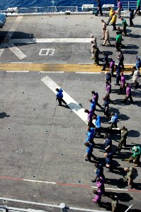 US Navy 090405-N-6410J-035 Sailors and Marines conduct a foreign object damage walk-down during flight quarters