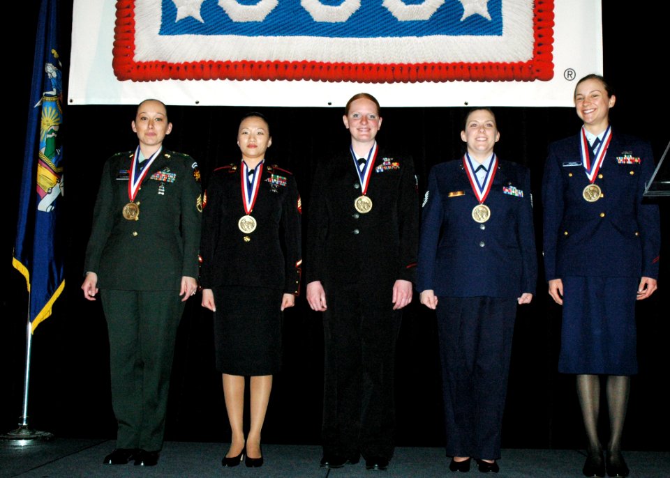 US Navy 090407-N-6897L-056 Hospital Corpsman 2nd Class Britni Godfrey, center, assigned to Naval Health Clinic Great Lakes, received the