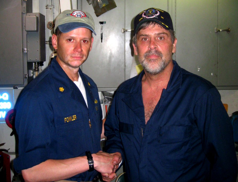 US Navy 090412-N-XXXXN-003 Maersk-Alabama Capt. Richard Phillips, stands alongside Lt. Cmdr. David Fowler, executive officer of USS Bainbridge (DDG 96)