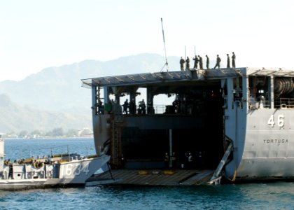 US Navy 090413-N-9950J-063 Armed Forces of the Philippines Marines wait on a landing craft utility from Assault Craft Unit One (ACU-1) before embarking the amphibious dock landing ship USS Tortuga (LSD 46)