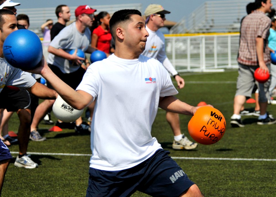 US Navy 090411-N-2013O-397 Hospital Corpsman 3rd Class Rigo Venegas, from Houston, winds up for a throw as members of the Fleet Activities Yokosuka community attempt to break the world record for the most people in a dodge ball