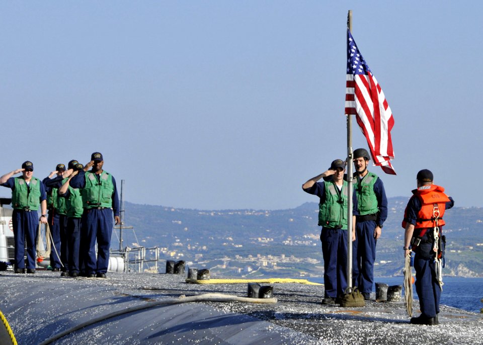 US Navy 090417-N-0780F-005 ailors aboard the guided-missile submarine USS Florida (SSGN 728) salute the national ensign after arriving in Souda Bay