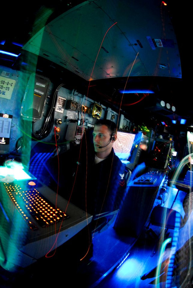 US Navy 090414-N-6538W-233 Air Traffic Controller 2nd Class Andrew Brice, from Hershey, Penn., stands watch in the Carrier Air Traffic Control center before flight operations aboard the Nimitz-class aircraft carrier USS John C