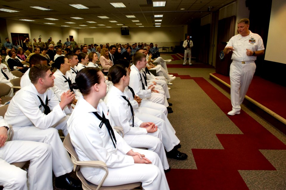 US Navy 090415-N-5319A-002 Senior Chief Mass Communication Specialist Dennis Taylor speaks about the qualities of Mass Communication Specialist 1st Class Bobby McRill to a Mass Communication Specialist graduating class at Defen