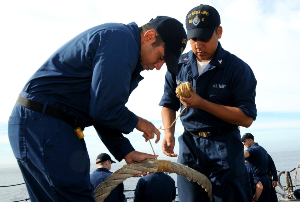 US Navy 090417-N-3666S-030 Sailors repair mooring lines on the flight deck of the guided-missile frigate USS Reuben James (FFG 57)
