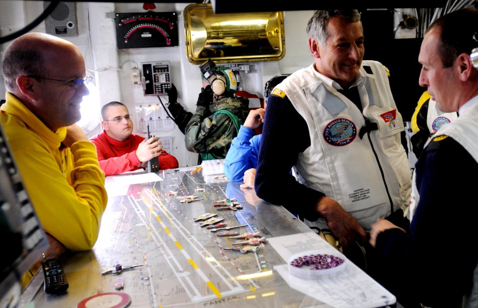 US Navy 090416-N-7730P-261 Adm. Sir Jonathon Band, First Sea Lord and Chief of Naval Staff of the Royal Navy, and fellow Royal Navy Officers are given an explanation as to the use of the Oiuja board