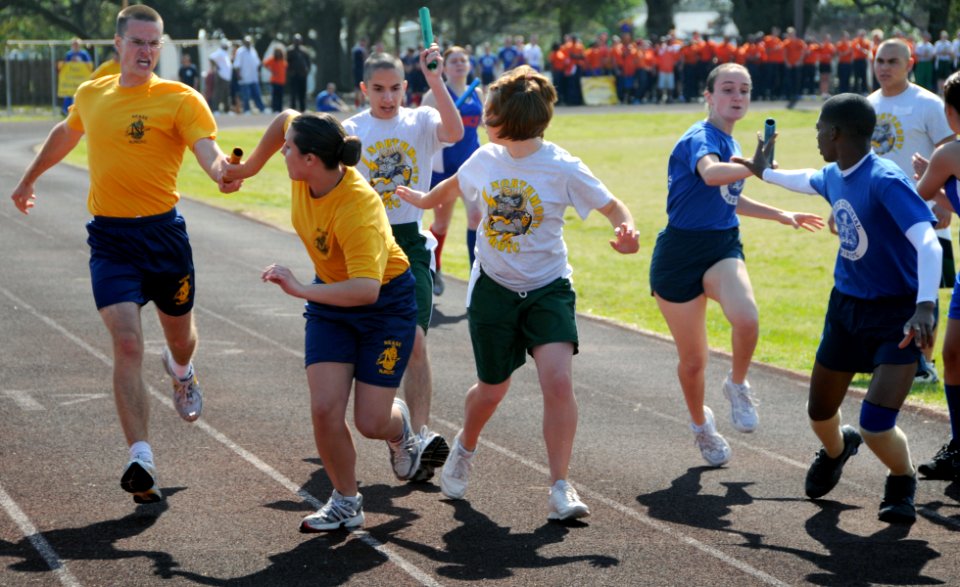 US Navy 090417-N-8848T-321 Navy Junior ROTC cadets hand off batons during a 8x220-yard Oval Relay during the 2009 NJROTC National Academic, Athletic and Drill competition at Naval Air Station Pensacola