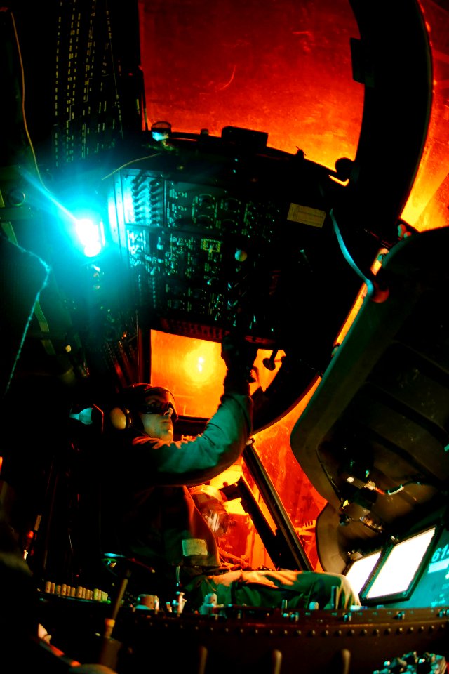 US Navy 090418-N-6538W-343 Aviation Machinist's Mate Airman Trenton Warren onducts post flight checks in the cockpit of an MH-60S Sea Hawk from the