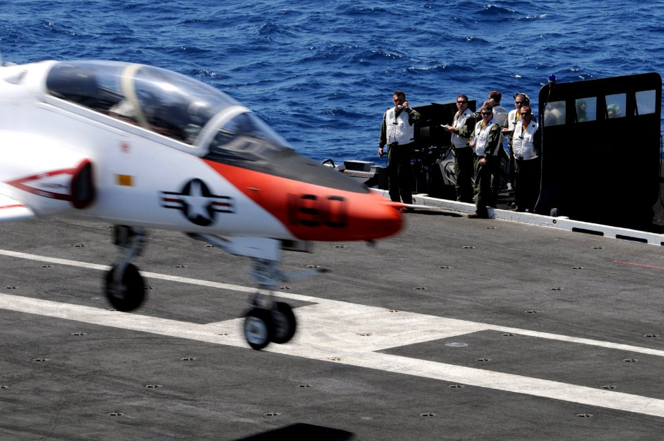 US Navy 090417-N-3659B-143 A T-45 Goshawk prepares to make an arrested landing aboard the aircraft carrier USS Ronald Reagan (CVN 76)