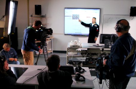 US Navy 090417-N-5328N-030 Discovery Channel Cinematographer Tom Inskeep,videotapes Cryptologic Technician (Interpretive) 1st Class Angel Diaz, assigned to the Center for Information Dominance, Detachment Monterey
